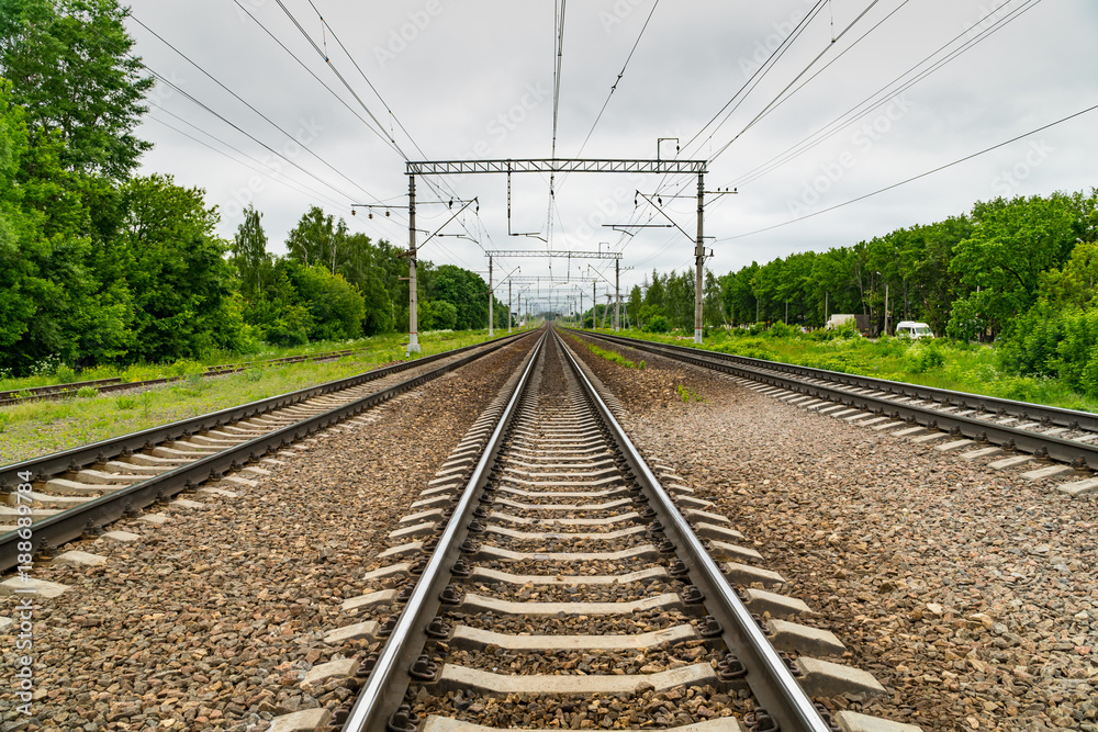 Train tracks go over the horizon line