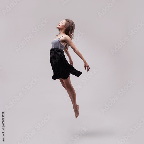 young beautiful woman dancer jumping