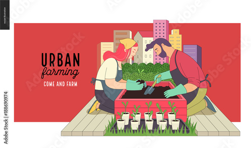 Urban farming, gardening or agriculture. A man and a woman planting out the sprouts to the wooden package bed with a city tower buildings on the background