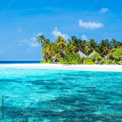 On vacation in a tropical island in ocean. Tropical island in the ocean. Palm trees on white sand beach. Maldives. A great place to relax. © patma145