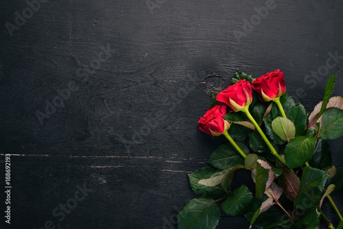 Red rose on a wooden background. Valentines day. Love. Top view. Free space for your text.