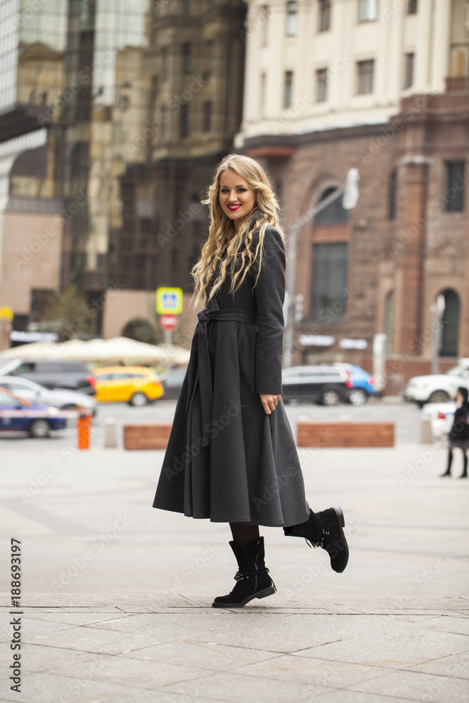 Portrait of a young beautiful woman in gray coat Portrait of a young beautiful woman in gray coat