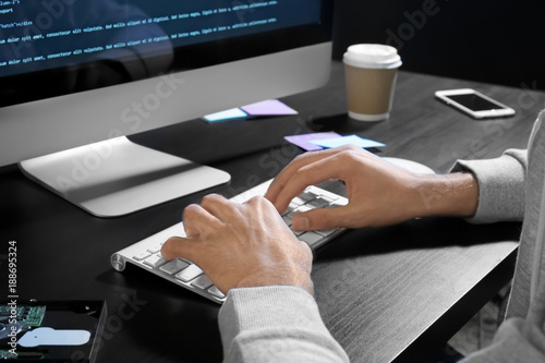 Man hacking server at table