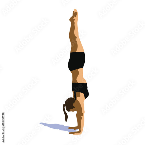 Sportswomen stands on her hands