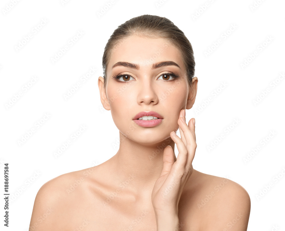 Portrait of beautiful young woman with clear skin on white background