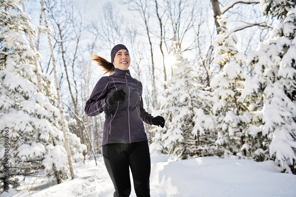 Woman Running in Snowy Park Woman Running in Snowy Park