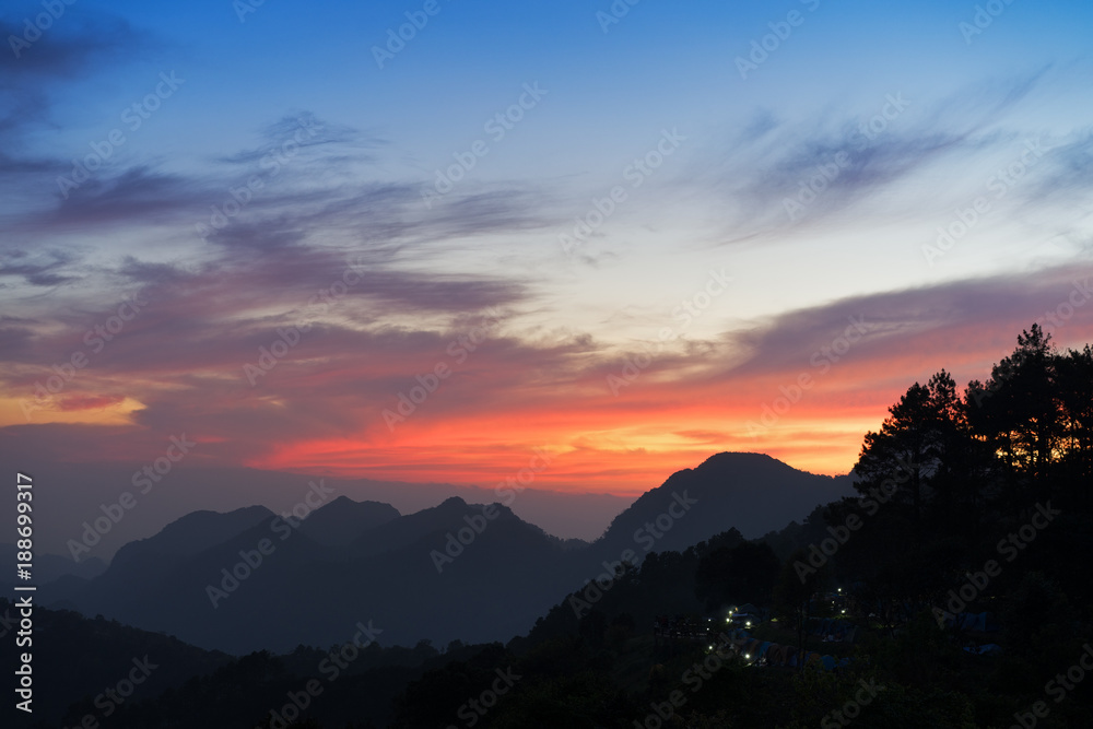 Obraz premium Amazing sunset.Natural Sunset Sunrise Over Mountain. Bright Dramatic Sky And Dark Ground.Colorful sky in the sunset.