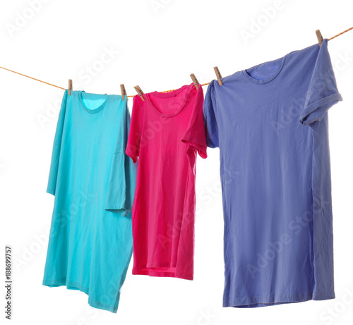 Clothes on laundry line against white background