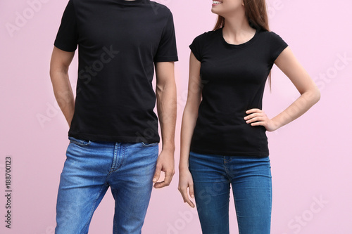 Young woman and man in blac...