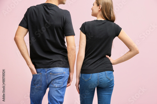 Young woman and man in blac...