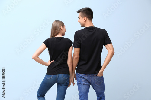 Young woman and man in blac...