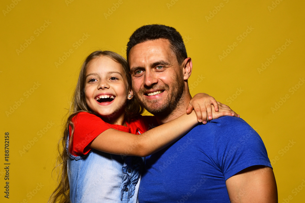 Obraz premium Family time and parenthood concept. Man and girl hug