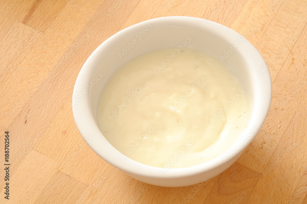 How to cook Italian lasagna, top view of bechamel sauce on a kitchen table How to cook Italian lasagna, top view of bechamel sauce on a kitchen table