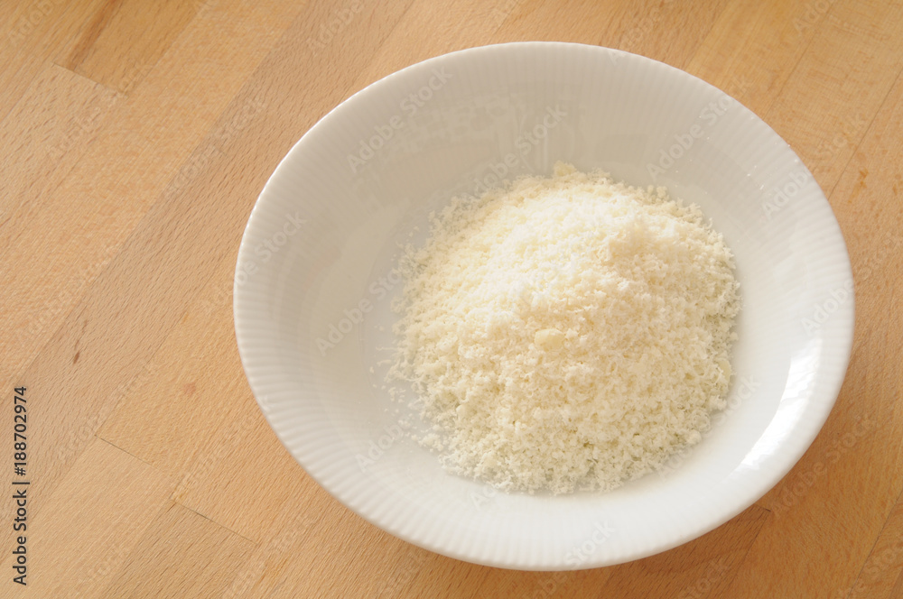 How to cook Italian lasagna, bowl of grated parmesan cheese How to cook Italian lasagna, bowl of grated parmesan cheese