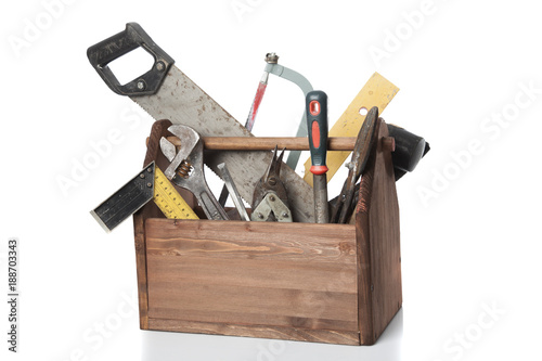 Old Carpenter Wooden toolbox with tools isolated on white photo
