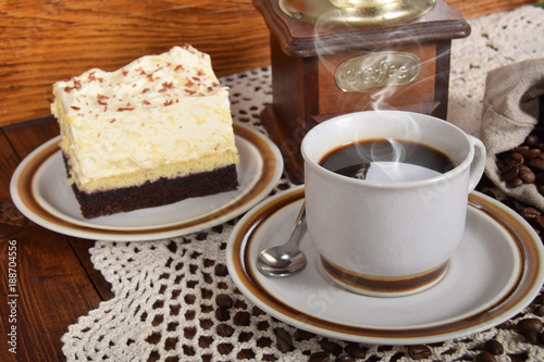 black coffee in a cup with chocolate cake