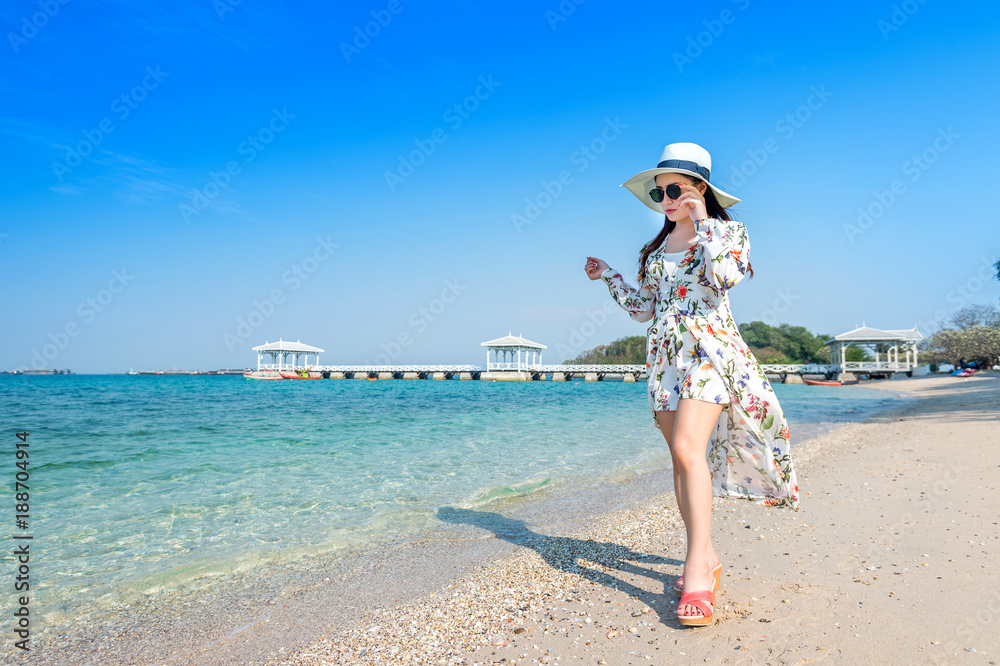 Young woman walking on beach in Si chang island, Thailand. Young woman walking on beach in Si chang island, Thailand.