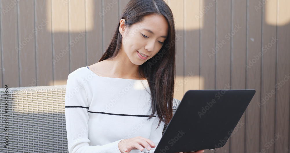 Woman checking on laptop computer