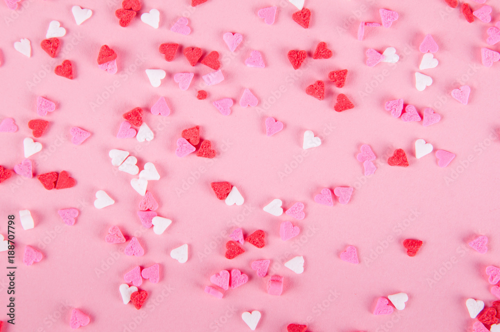 heart sprinkles on a pink background