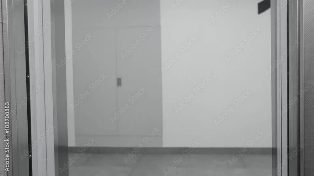 Elevator is arriving and doors open. Blue tone Elevator is arriving and doors open. Blue tone