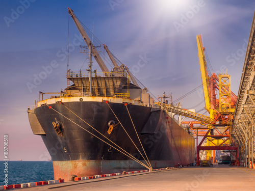 Bulk Vessel alongside at thailand port and loading bulk cargo by  shiploader.