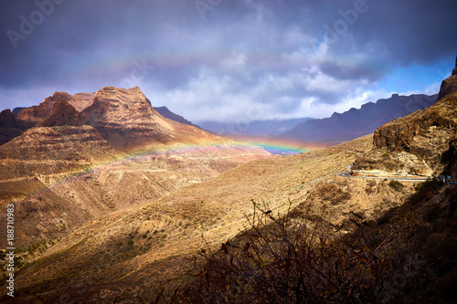 Rainbow over Mountain landscape of Gran Canaria island, Spain / Valley of "Fataga" seen from the viewpoint "Degollada de la yegua"
