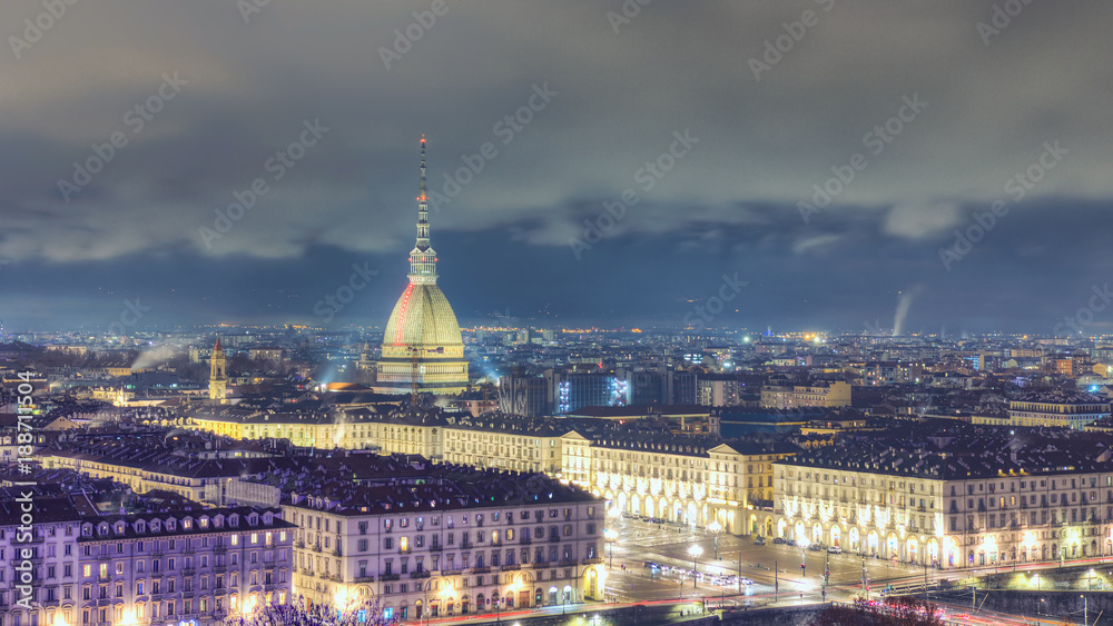 27 December 2018, Turin TO, Italy: View from above of the city of Turin. Mole Antoneliana and Piazza Vittorio in the foreground. At night during Christmas