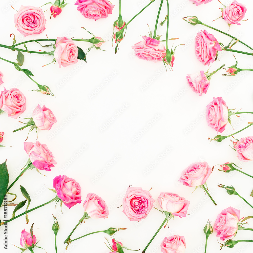 Floral round frame made of pink roses, buds and leaves on white background. Valentines day. Flat lay, Top view.