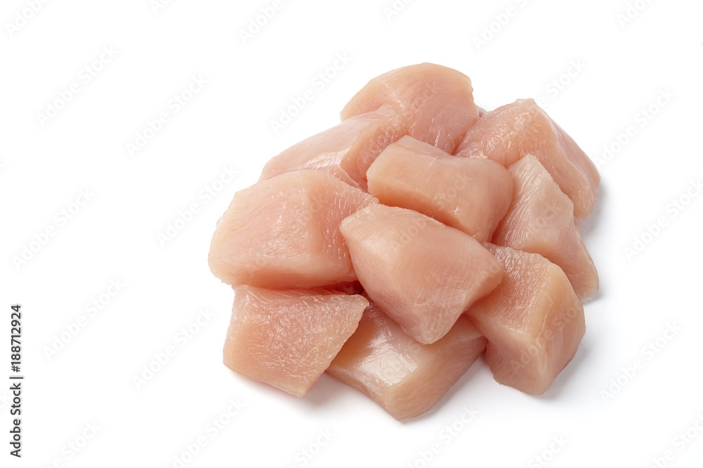Medium-sized raw chicken cubes isolated on white background Medium-sized raw chicken cubes isolated on white background
