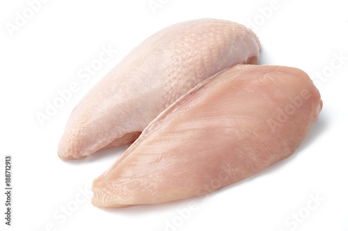 Raw chicken fillet with and without skin isolated on white background