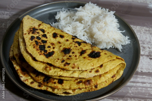 Chickepea flour flat bread or besan ki roti with rice. photo