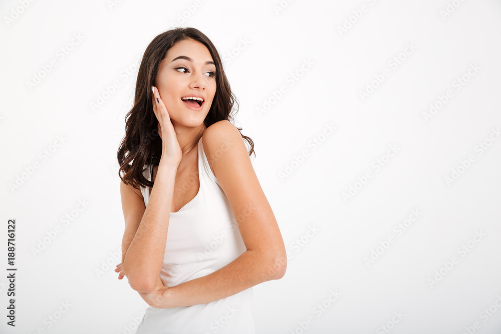 Portrait of a pretty girl dressed in tank-top looking away Portrait of a pretty girl dressed in tank-top looking away