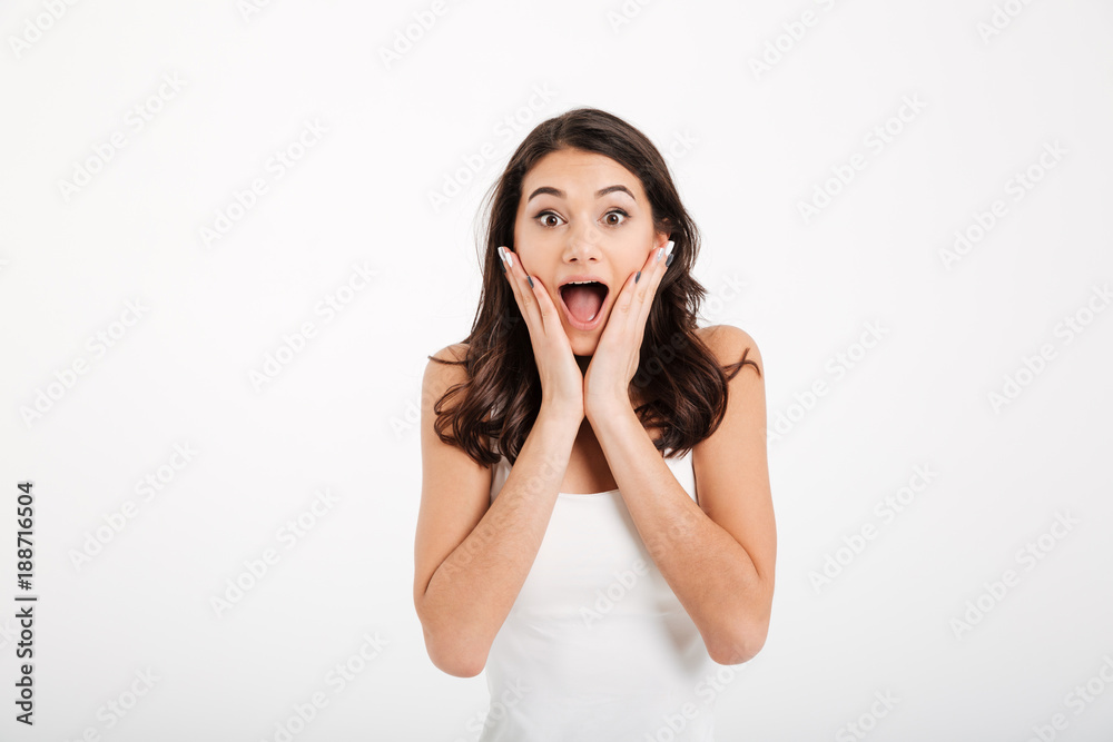 Portrait of an astonished girl dressed in tank-top Portrait of an astonished girl dressed in tank-top