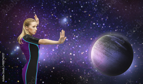 futuristic woman over planet and stars in space