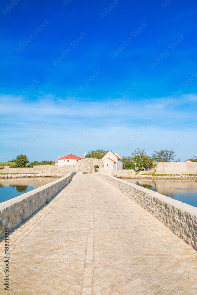     Ancient stone bridge in town of Nin, Dalmatia, Croatia 