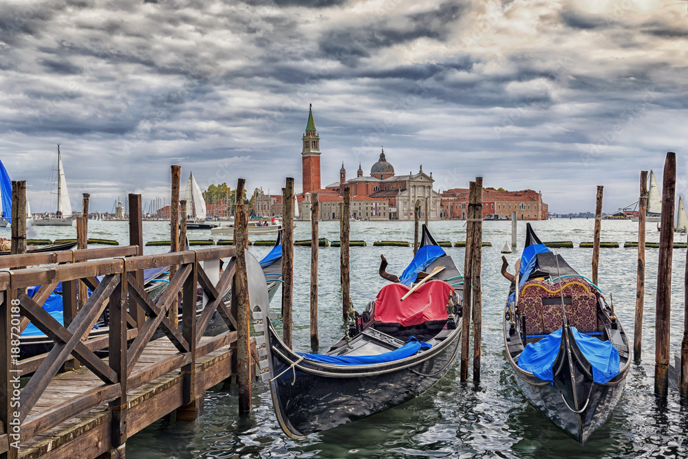 Gondals moored at waterfront, Riva degli Schiavoni, with view to San Giorgio Maggiore, Venice, UNESCO World Heritage Site, Veneto, Italy, Europe