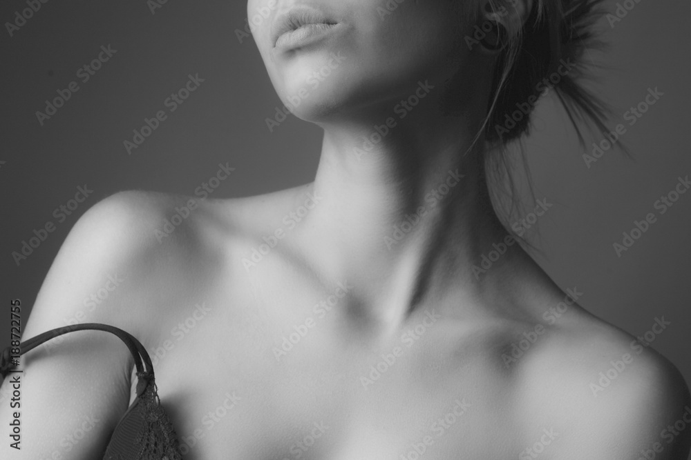 Fototapeta premium Shoulders and neck of a beautiful woman. Black and white