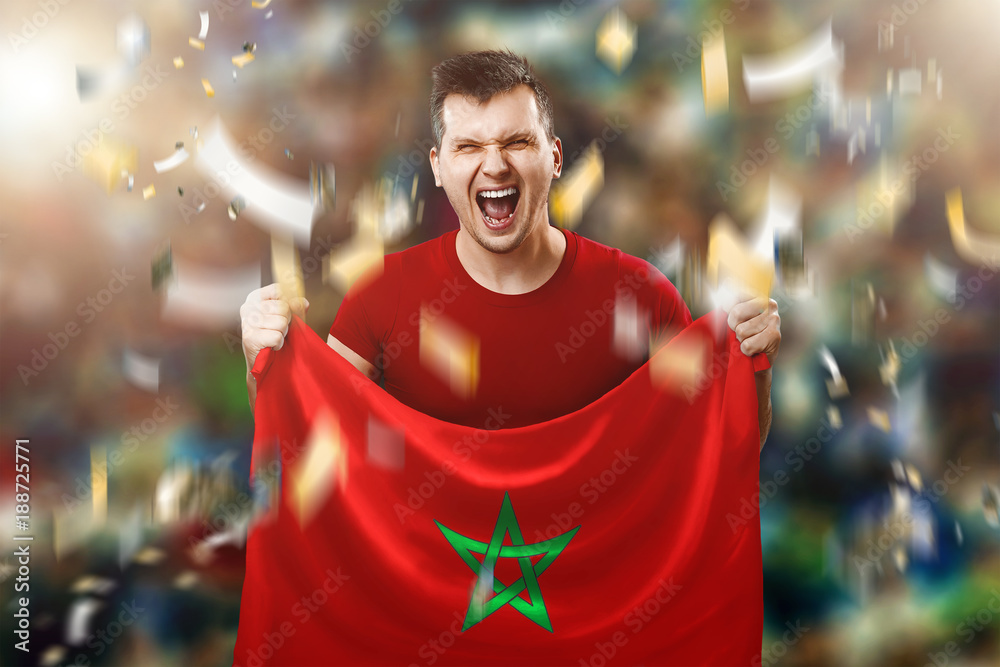 A Moroccan fan, a fan of a man holding a Morocco national flag in his  hands. Soccer fan in the stadium. Mixed media Stock Photo | Adobe Stock
