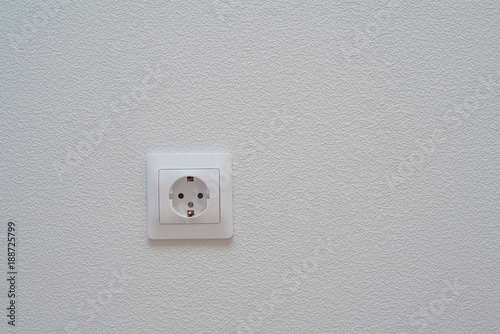 Power socket on plaster background. Place for text or design.