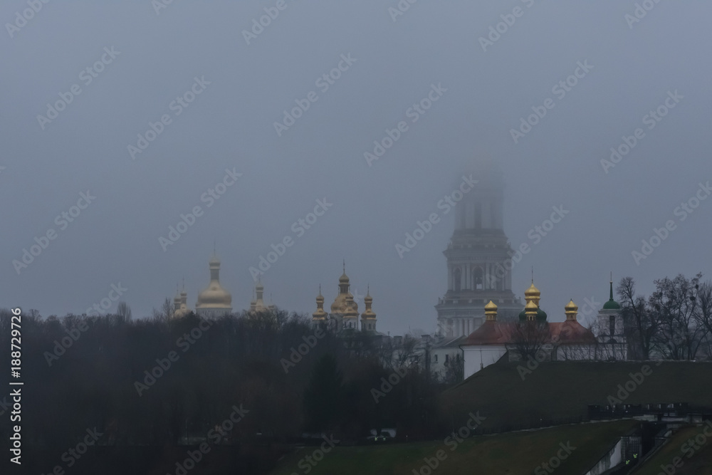 View of the Kiev Pechersk Lavra. Bell tower in a fog