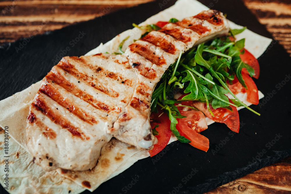 appetizing and delicious grilled meat dish with vegetables and herbs appetizing and delicious grilled meat dish with vegetables and herbs