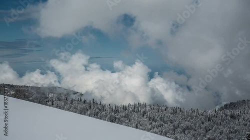 Puffy Boiling Clouds. Winter Highland. Wide Angle Parorama photo