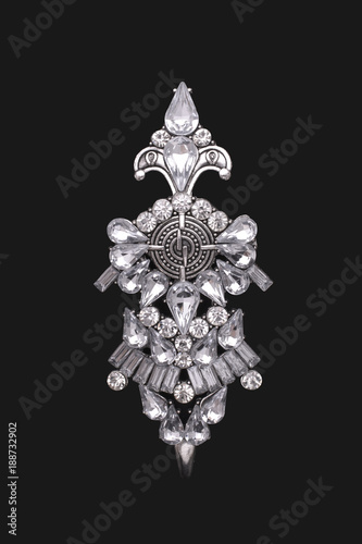 Slika na platnu Vintage brooch in Boho style with diamonds isolated on black