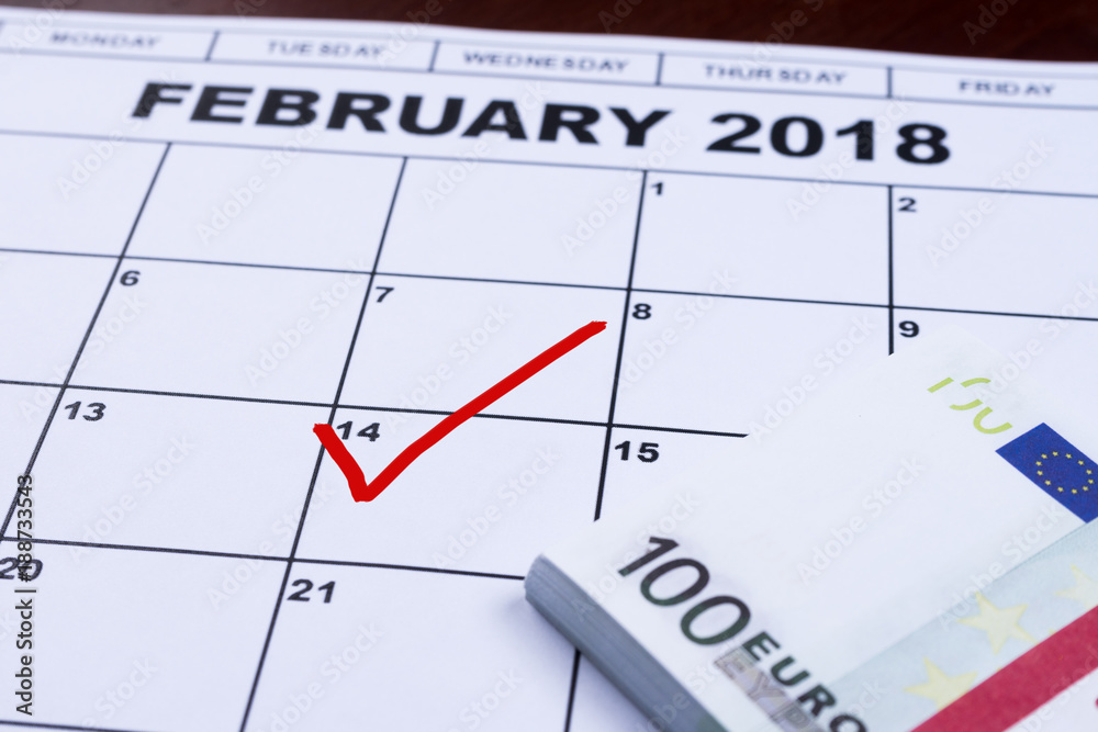 February 14 marked on the calendar and the money set aside for gifts. February 14 marked on the calendar and the money set aside for gifts.