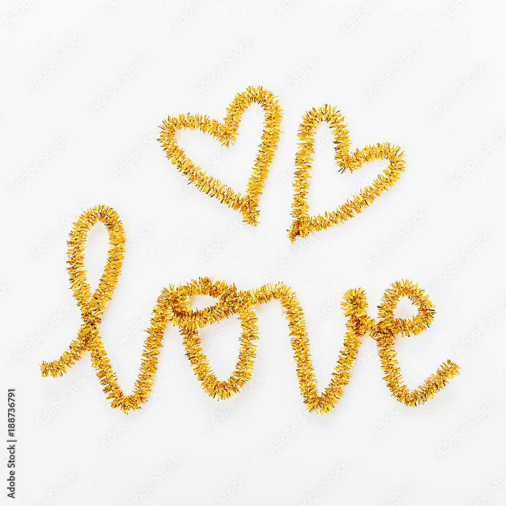 The word LOVE and Heart made of tinsel. Valentines day concept . Flat lay, top view The word LOVE and Heart made of tinsel. Valentines day concept . Flat lay, top view