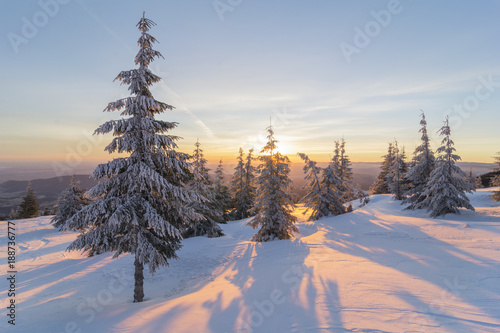 Beautiful sunrise in the mountains in winter time. Vladeasa massif in western Carpathians, Transylvania, Romania 