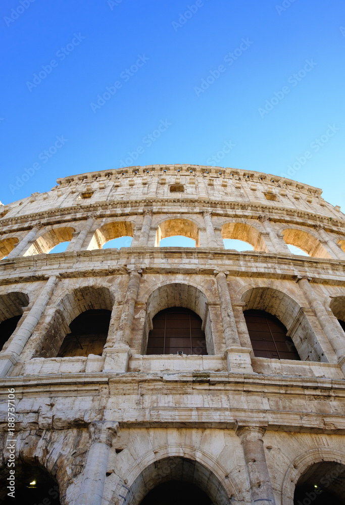 Colosseum Rome. Ruins of the  ancient Roman amphitheatre. Travel to Italy, Europe. Crowd and queue. Sunny day and blue sky