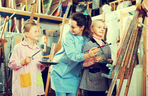 Female teachers assisting students