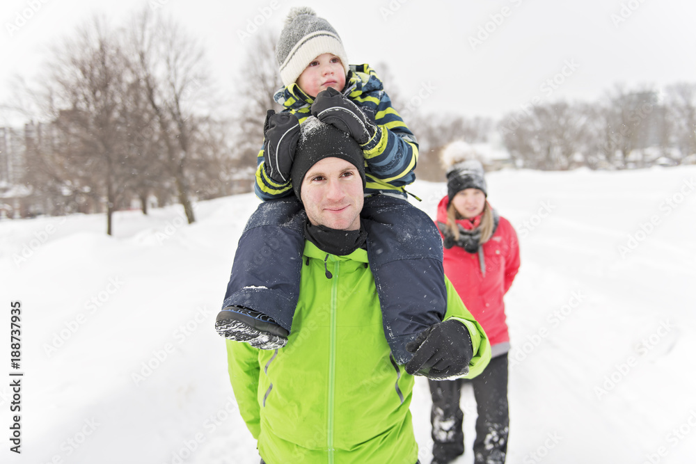 Family Through Snowy Landscape in winter season Family Through Snowy Landscape in winter season