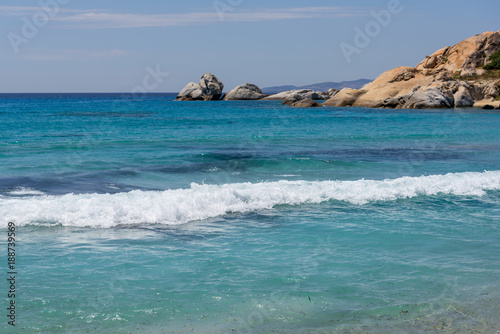 Sea with with shallow crystal clear sea water, Mikri Vigla beach on Naxos island, Greece